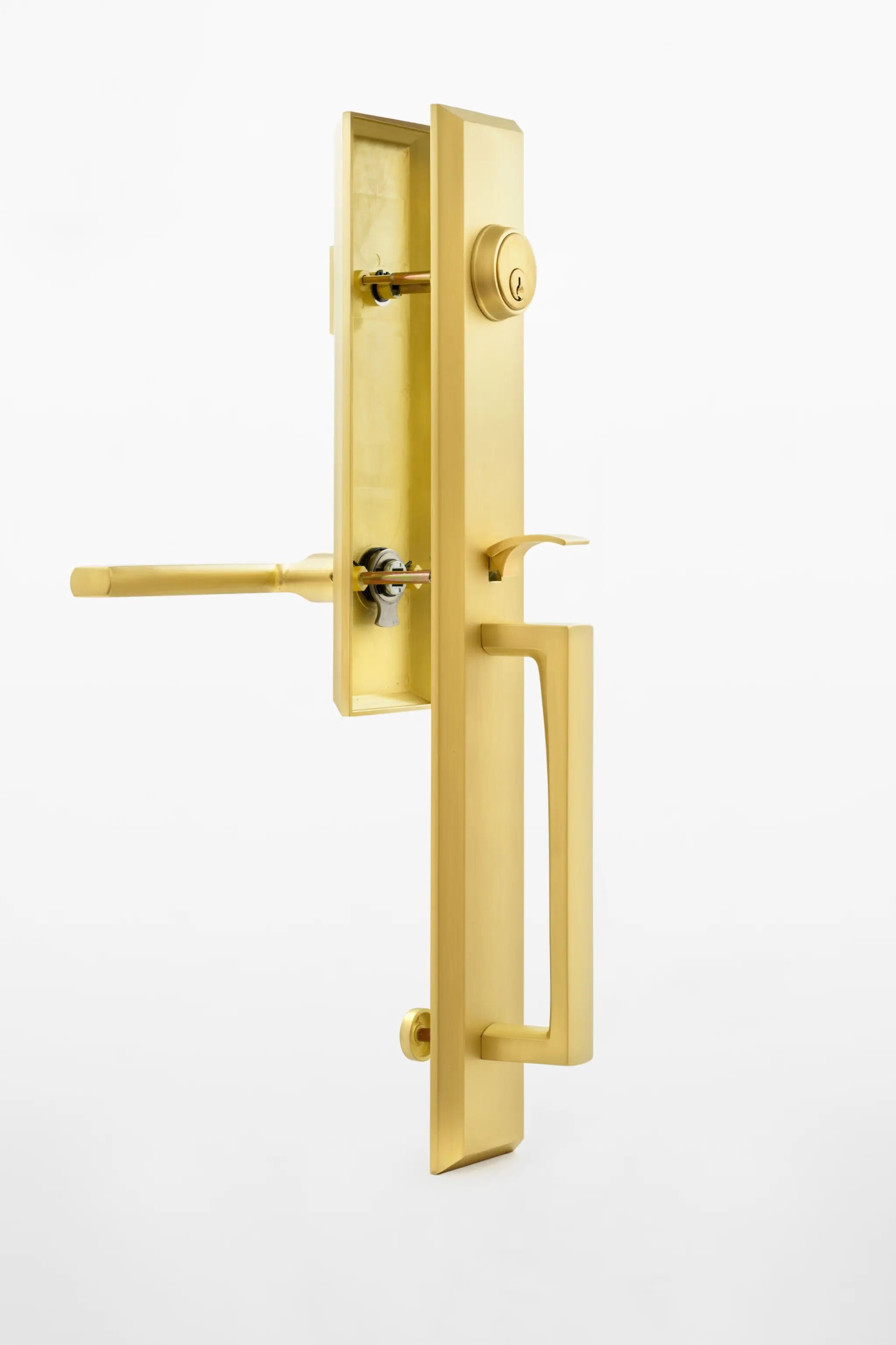 Gold door handle and lock mechanism on a white background