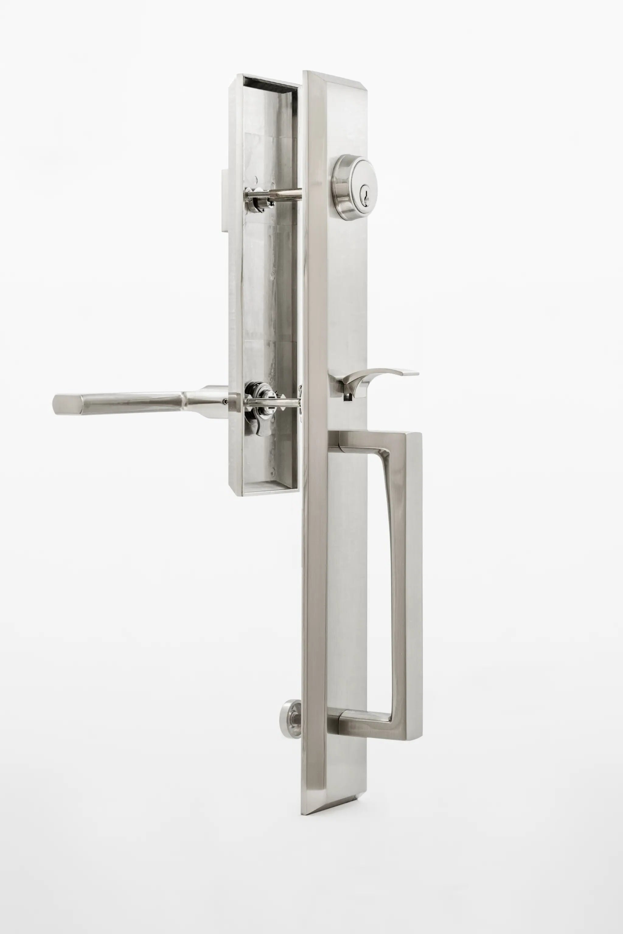 Modern door handle and lock set on a white background